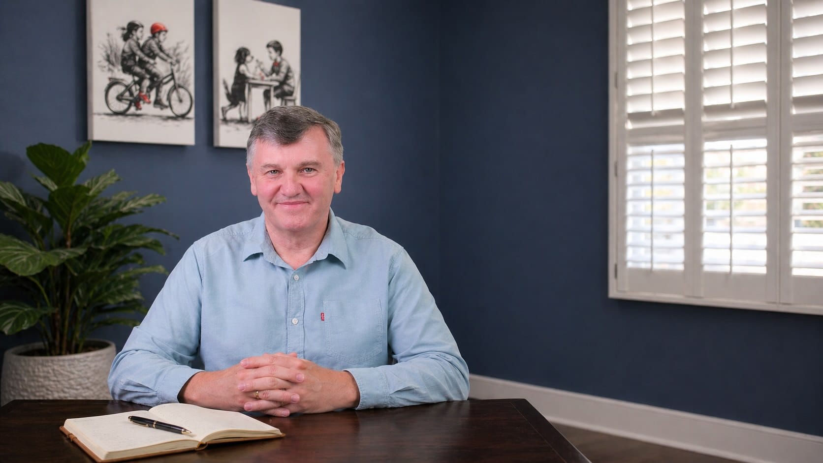 Dr John Flett at his consulting desk